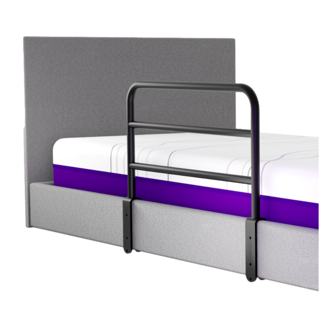 The iCare Medical Bed Safety Rails provide bedside support and enhanced safety with a high side rail, paired with a gray upholstered bed and a mattress featuring a purple stripe for fall prevention.
